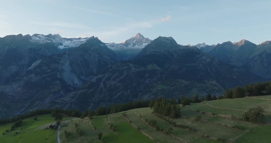 Aerial view of a mountain range at sunrise