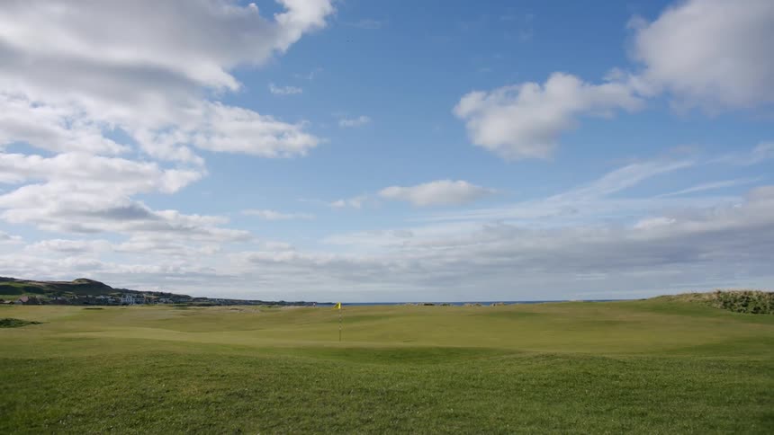 Flag on a golf course at midday