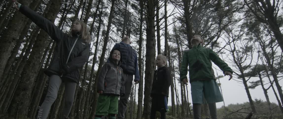 A group of children run off in the woods