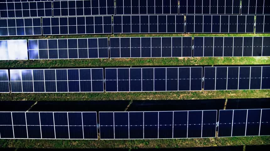 Close up aerial fly over of solar farm