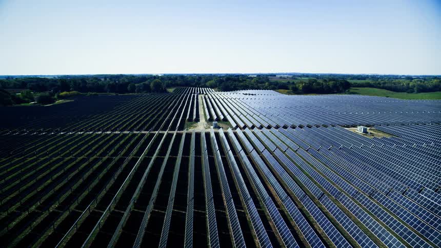 Aerial panorama of a solar panel field in American Midwest