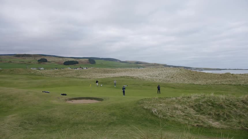Group of people playing golf