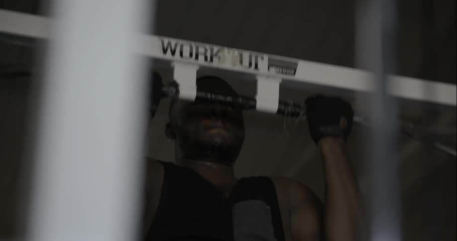 A man is doing pull ups