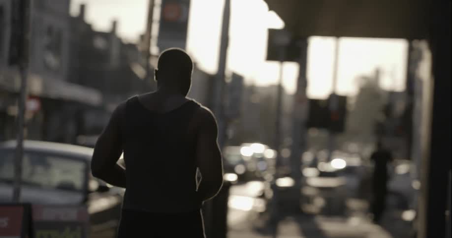 A man walks down a city street