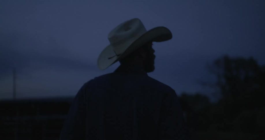 Cowboy backwards walking at night