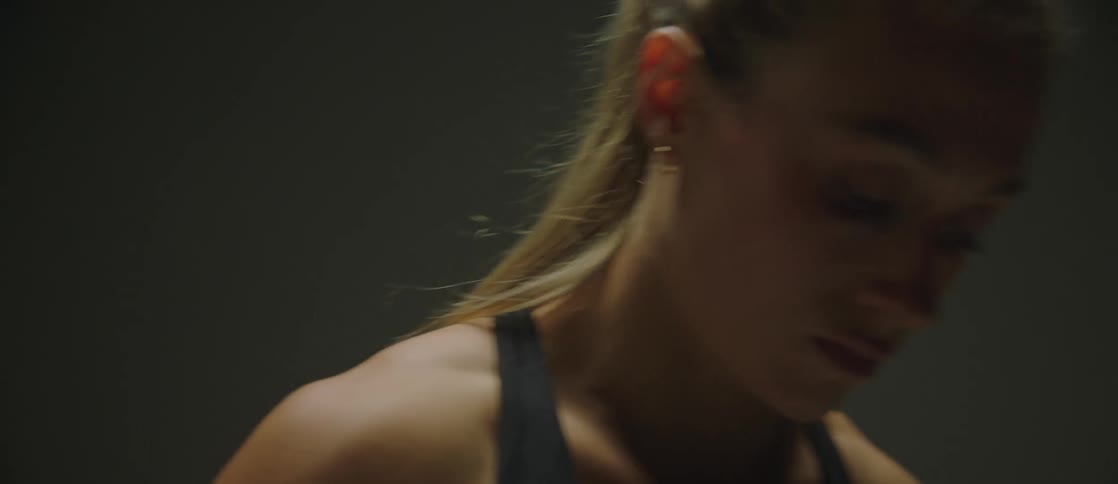 Closeup of a womans face in a dark room