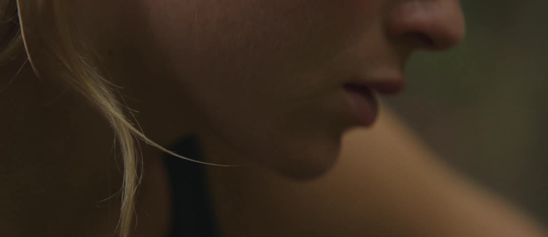 Sweat on the forehead of a woman stretching