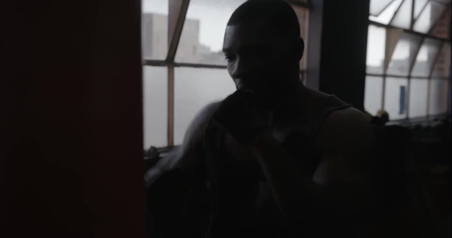 Man working out with a heavy bag