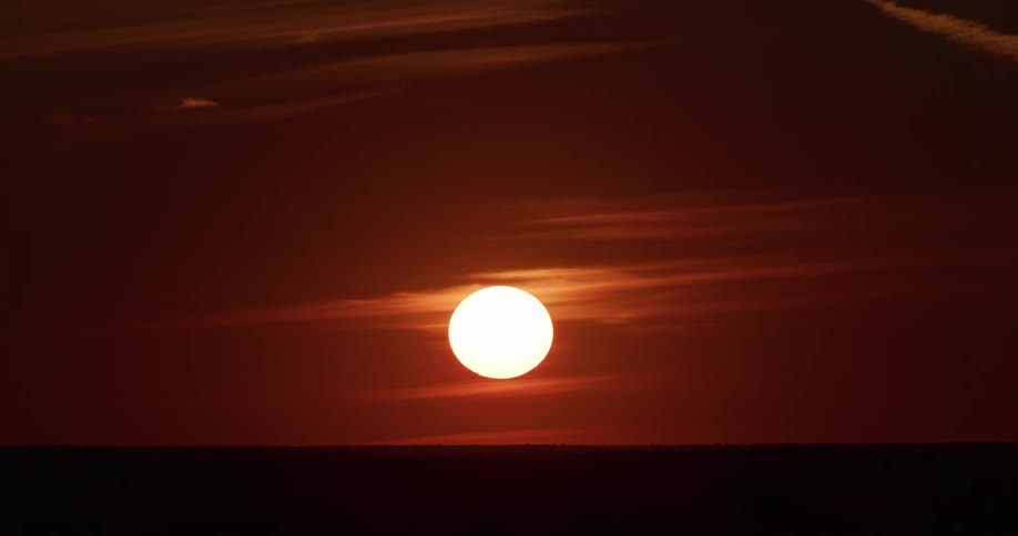 The sun setting causes a red sky