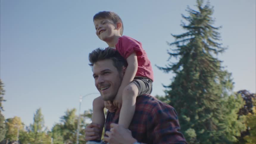 Father carrying his son on his shoulders