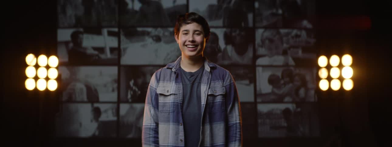 Portrait of a young smiling boy in an indoor room