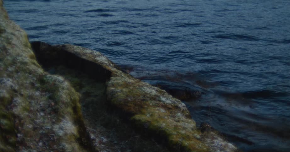 Rocky sea coast with calm waters during the day