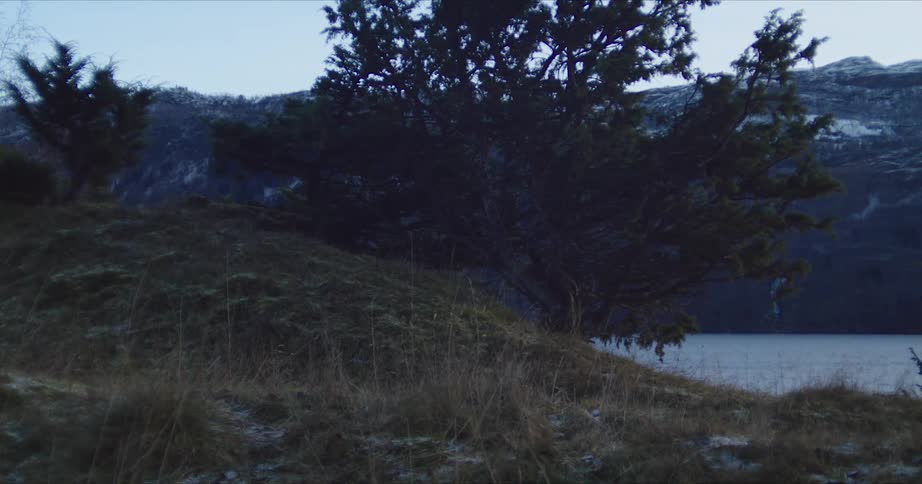 The lake sits by the mountain