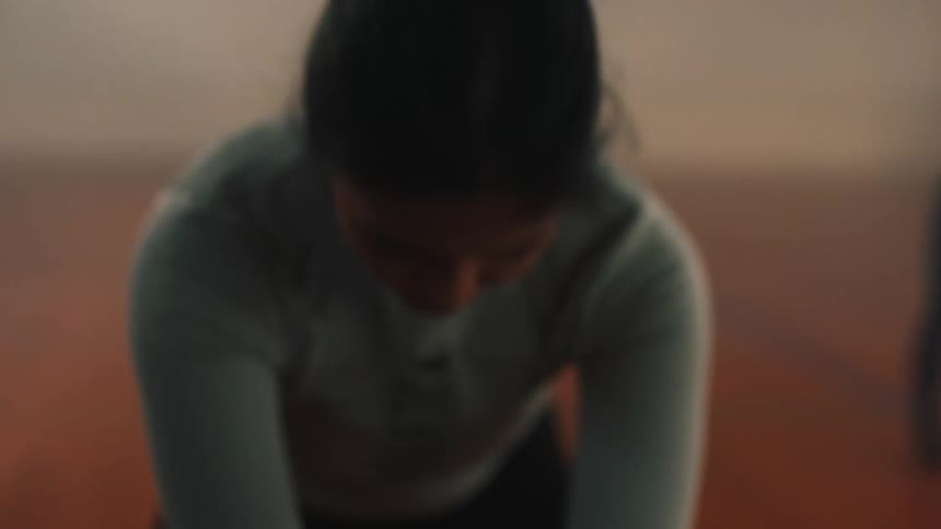 Women doing warmup exercises in a gym