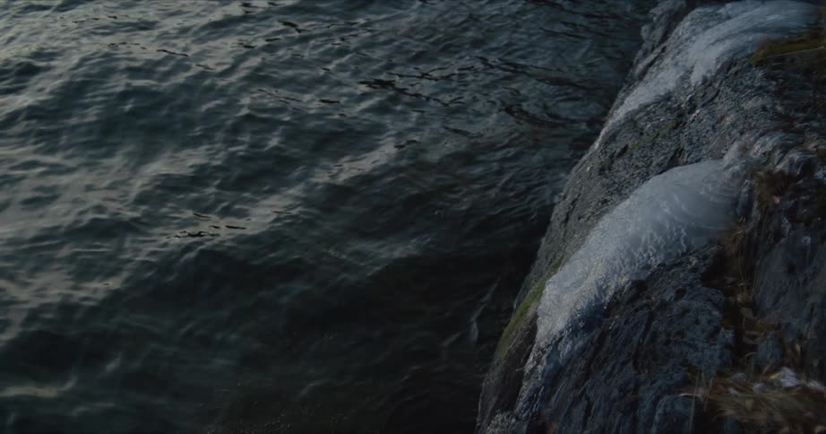 Small water waves by coast during the day