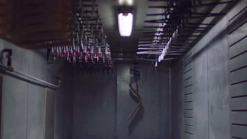 Internal room with hangerlike machinery in motion
