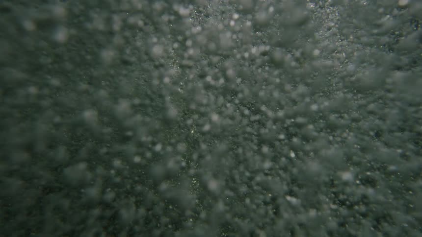 Bubbles move around underwater