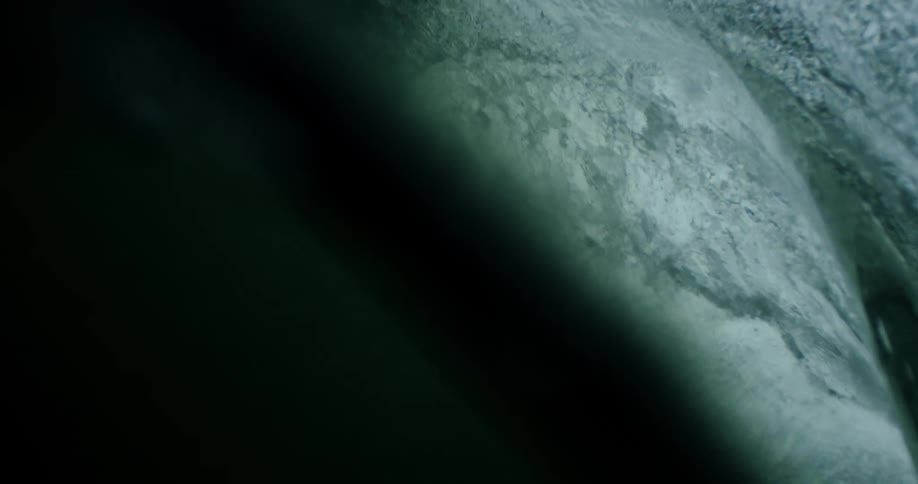 A massive wave breaks and crashes down with tremendous force