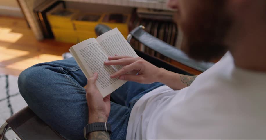 Man sitting and reading a book