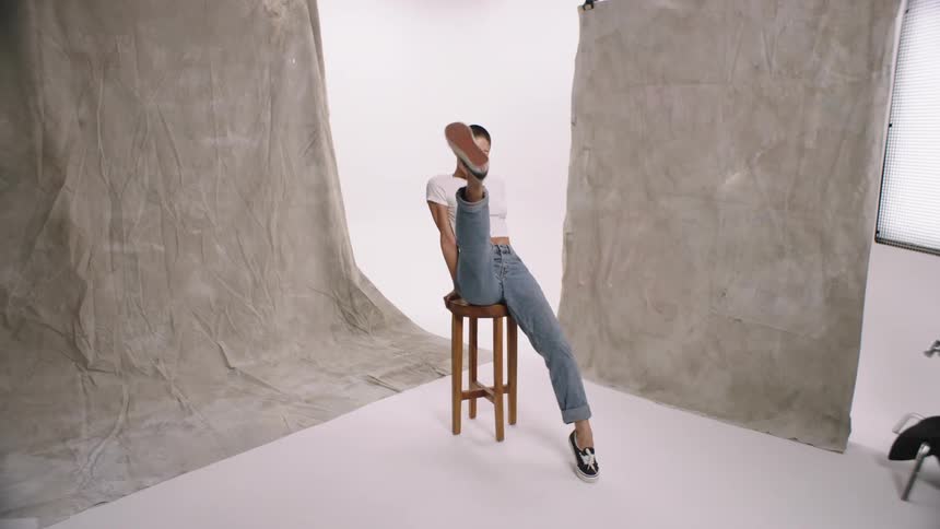 A model posing for a clothing photoshoot