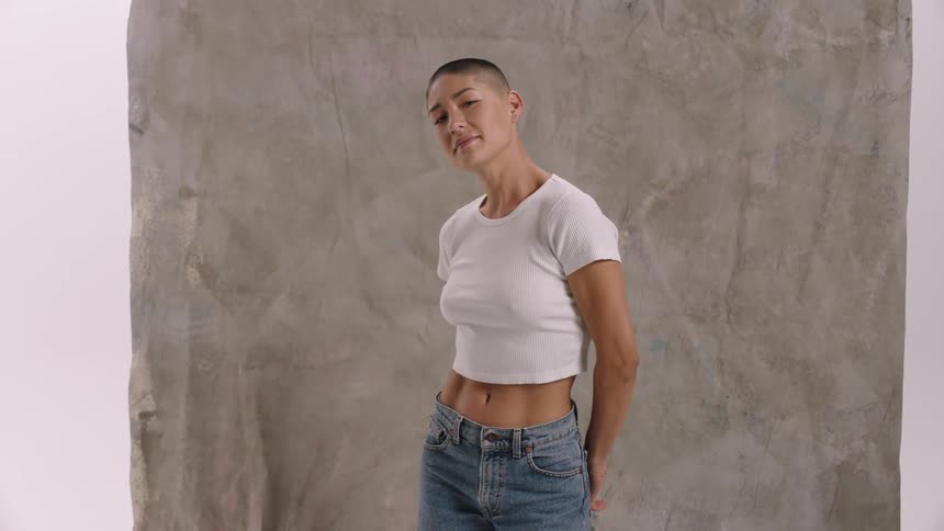 Portrait of a woman modeling in white shirt and jeans