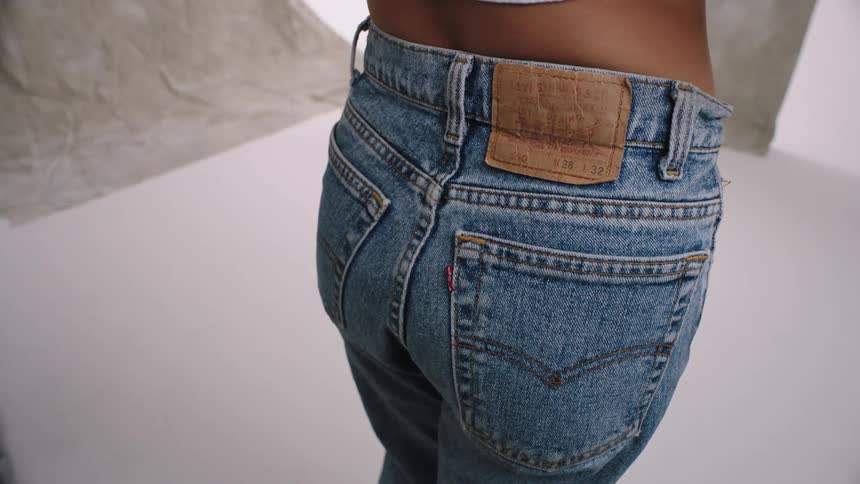 A person showing of a jean trouser