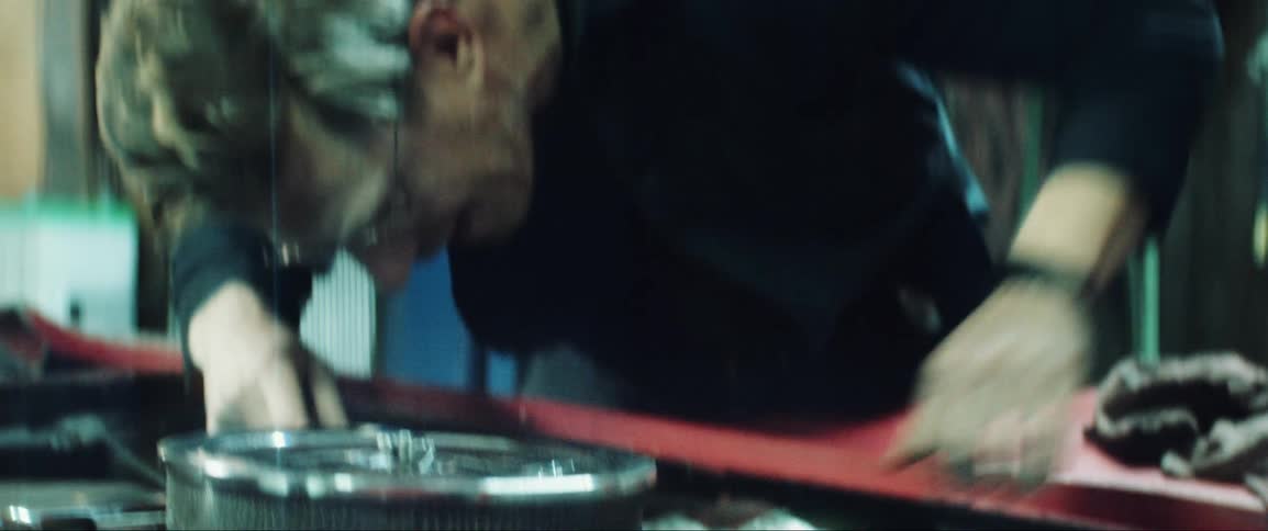 A mechanic repairing a car engine