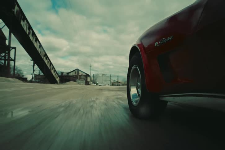 View of a classic red vehicle in motion