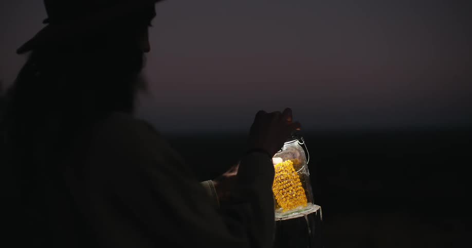 A woman turns on her lantern