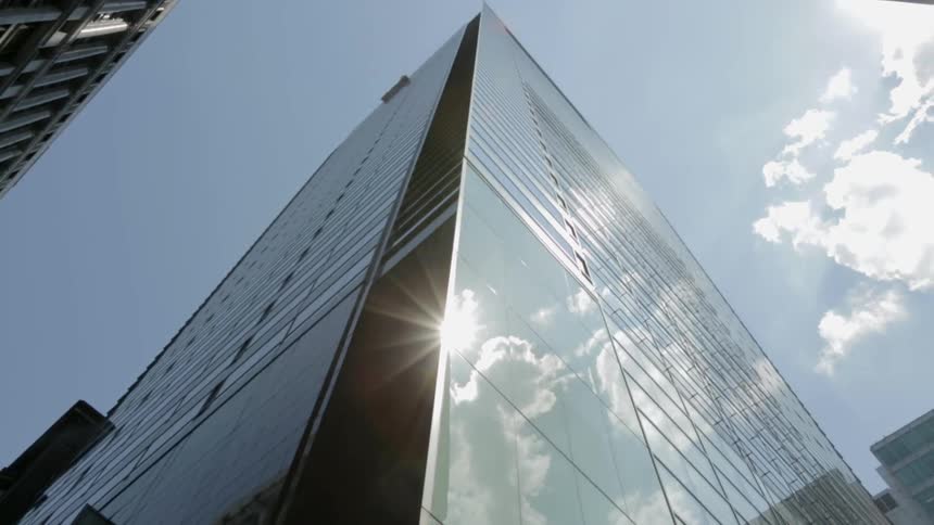 A tall building has mirrored windows