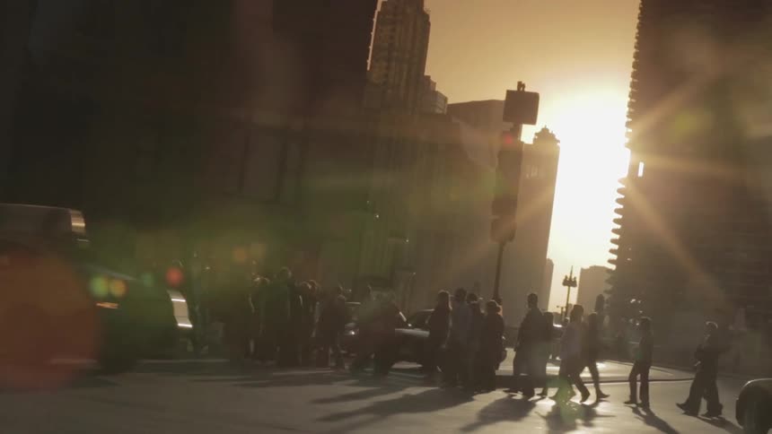 Busy city street at sunset