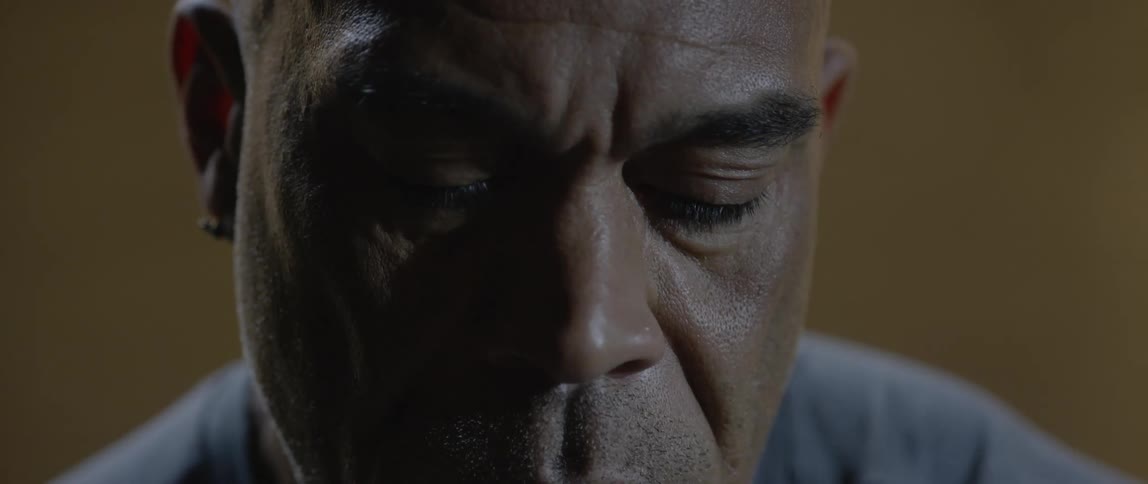 A man looking sad in a room