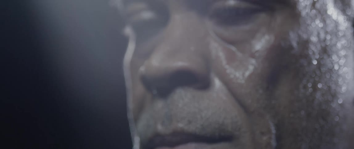 A mans face with sweaty skin