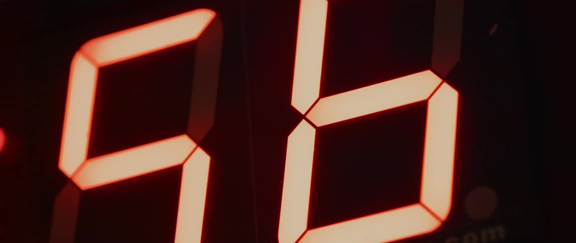 A digital board with glowing numbers counting