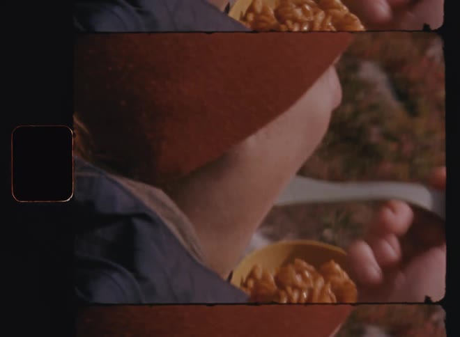 Woman eats pasta while sitting outdoors during an excursion