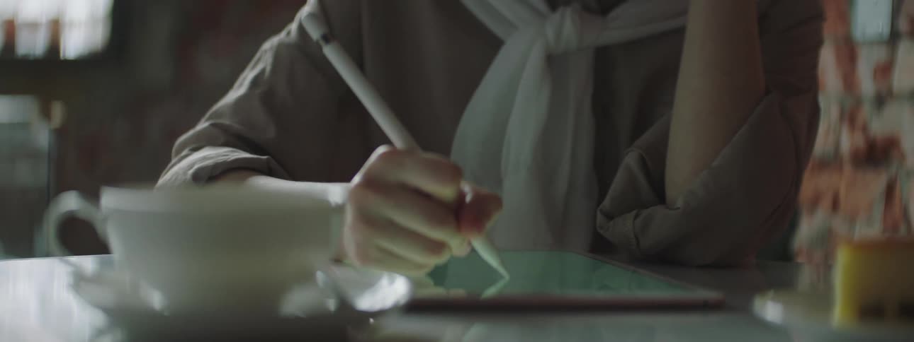 A clip of a person sketching on a tablet