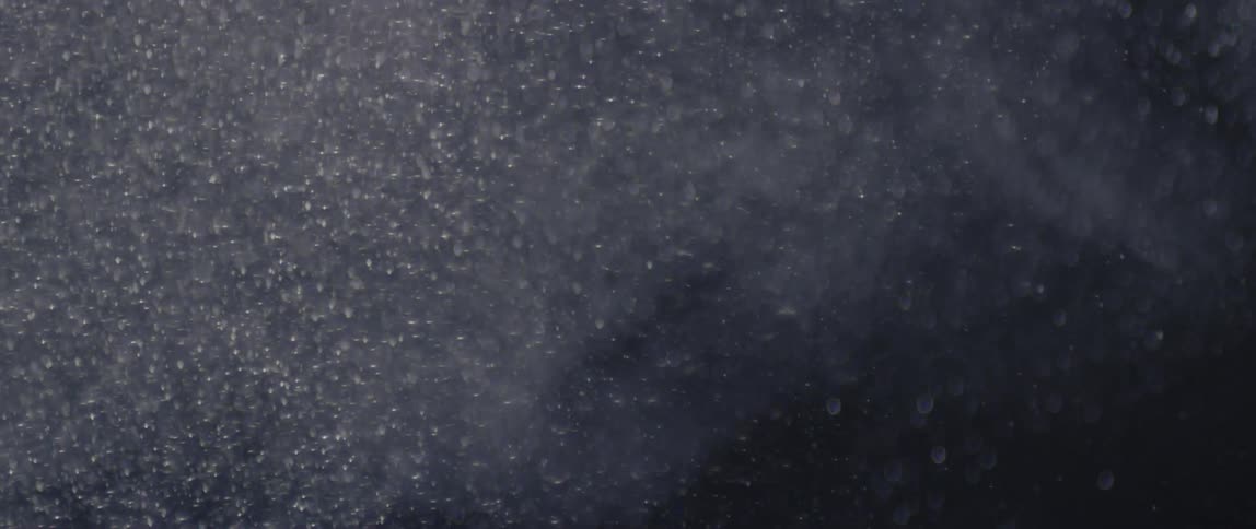 A clip of a moving falling snow in the night