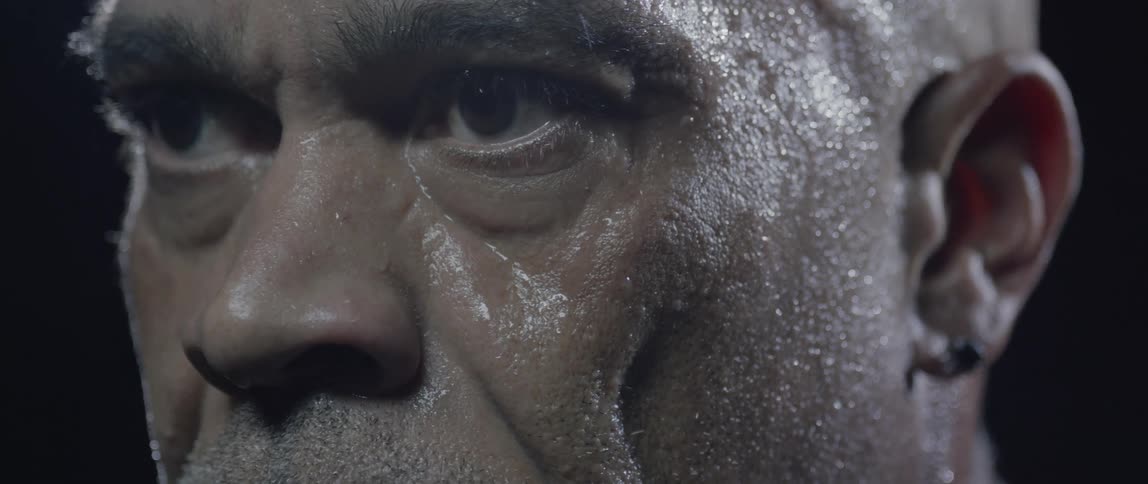 A mans face with sweaty skin