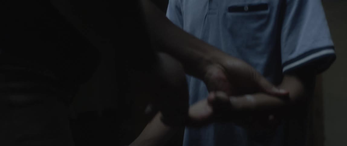 Man inspecting a childs hands