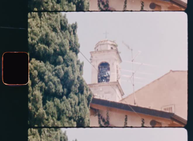 A large bell tower is on the church