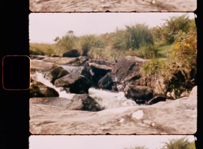 Water flowing on rocks at midday