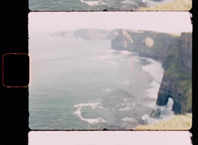 The waves crash against the cliffs