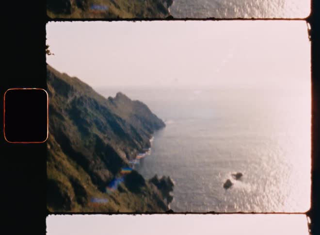 Mountainous coast with ocean on a sunny day