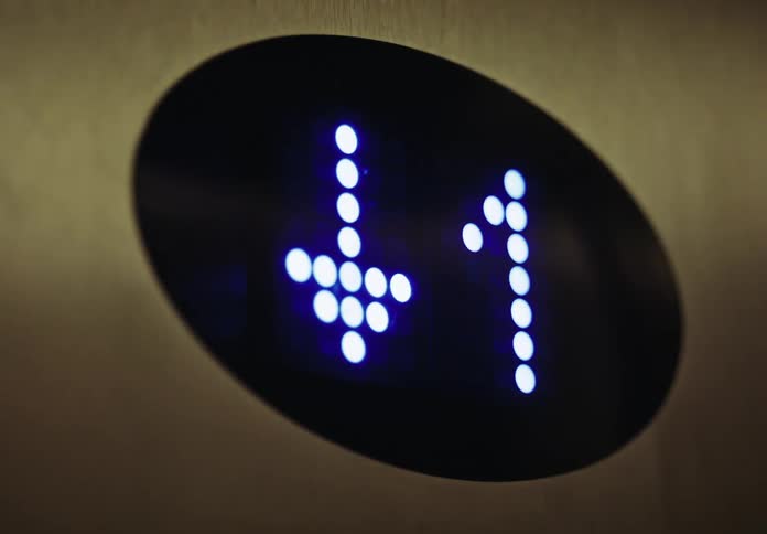 A small display with light indicates what floor an elevator car is at