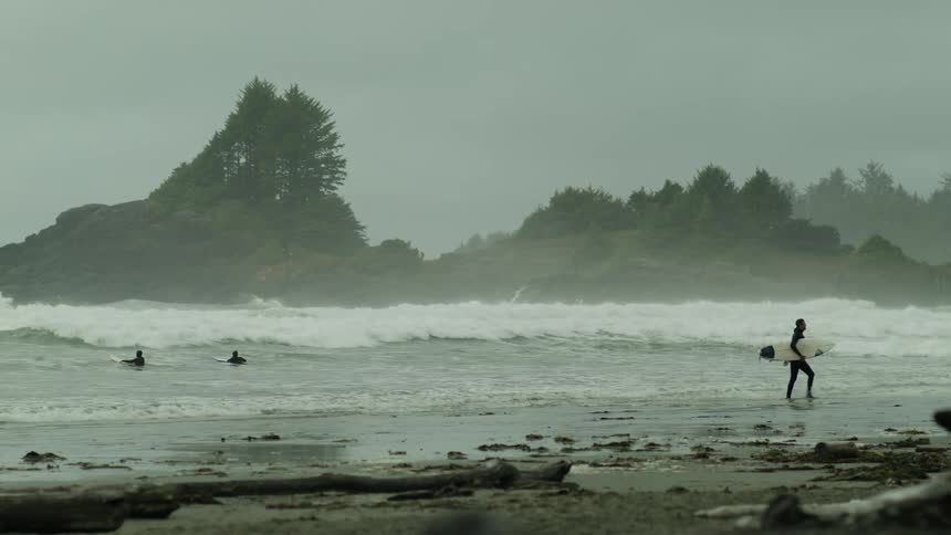 People surfing in the rough sea with dangerous waves