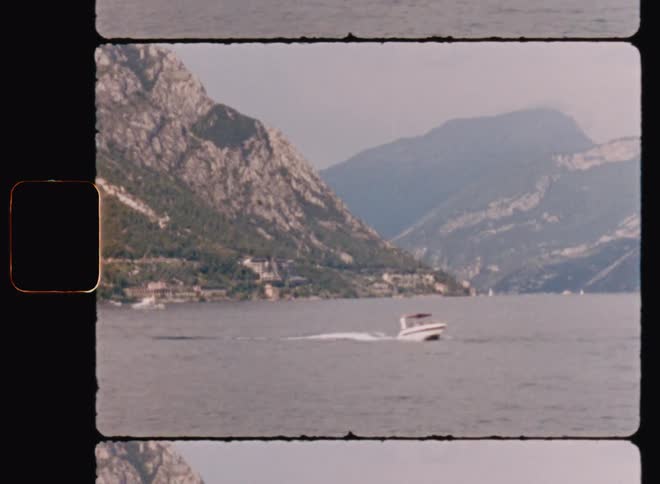 A boat travels from the coastal mountains