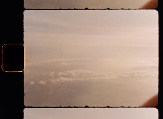 Archival aerial above rows of fluffy white clouds