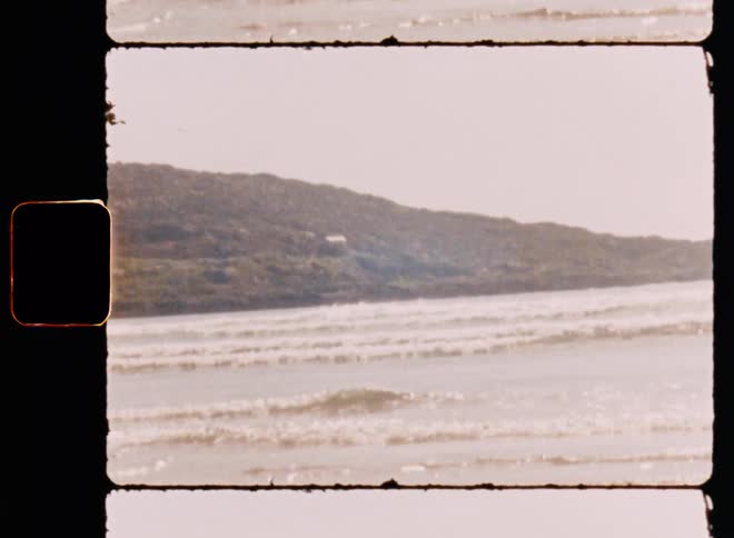 View of the sea with waves and the coast in a morning sky