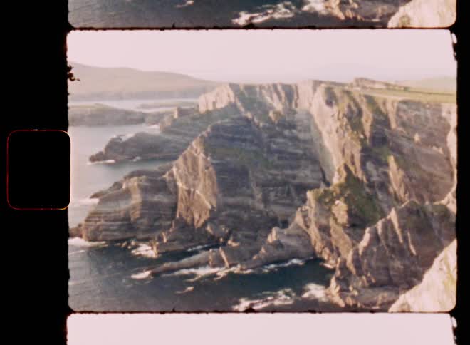 The island has tall cliffs by the ocean
