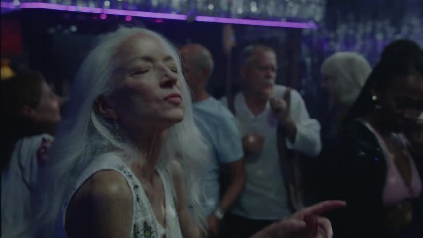 A lady dancing at a disco in the nightclub